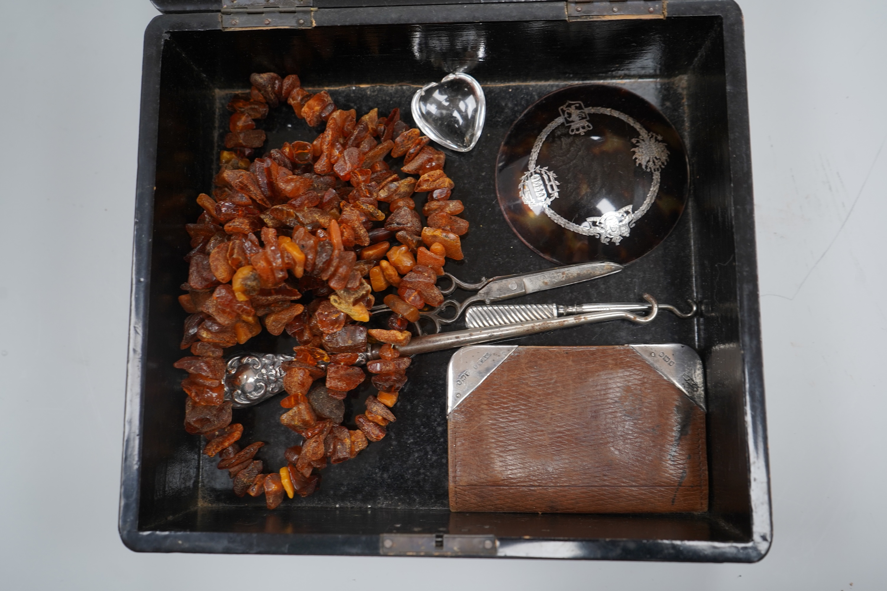 A group of costume jewellery and collector's items in a Japanese lacquer box